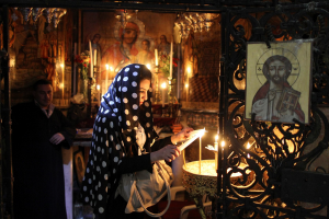 Lighting Candles In the Church of the Holy Sepulchre Lighting Candles In the Church of the Holy Sepulchre